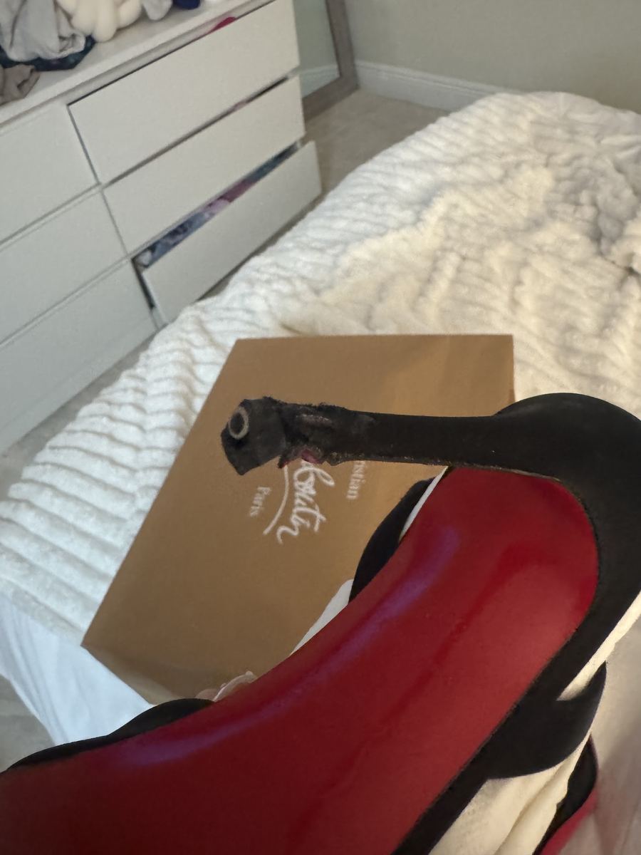 A pair of red-soled heels repaired at Alfredo Shoe Repair